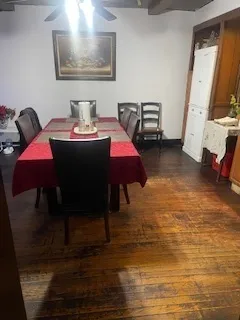 a bedroom with a bed and a mirror