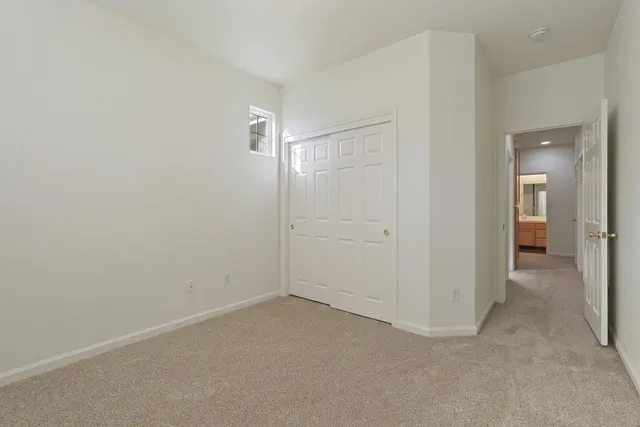 a bathroom with a shower sink and mirror