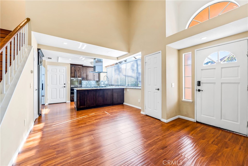 68 Marbella Aisle, Unit 34 Irvine, CA 92614 - Photo 11 of 38 Front door entry and living room detail. Looking towards the kitchen.