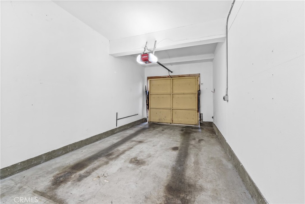 68 Marbella Aisle, Unit 34 Irvine, CA 92614 - Photo 33 of 38 Attached garage with auto charging outlet.