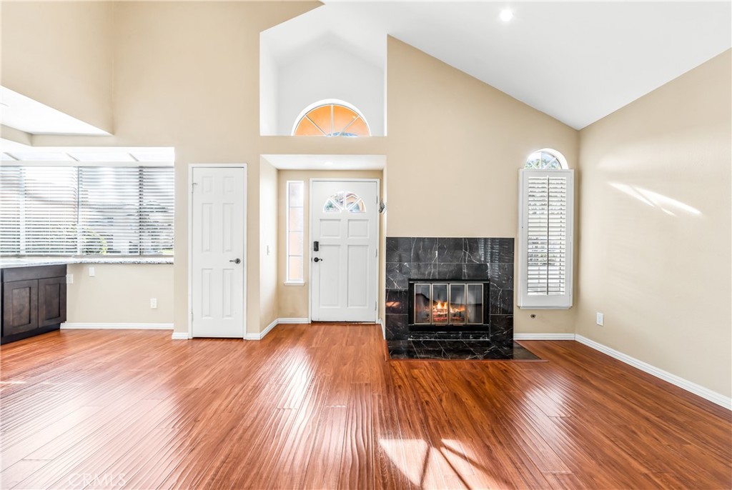 68 Marbella Aisle, Unit 34 Irvine, CA 92614 - Photo 38 of 38 Open floorplan with vaulted ceilings and a lovely fireplace.