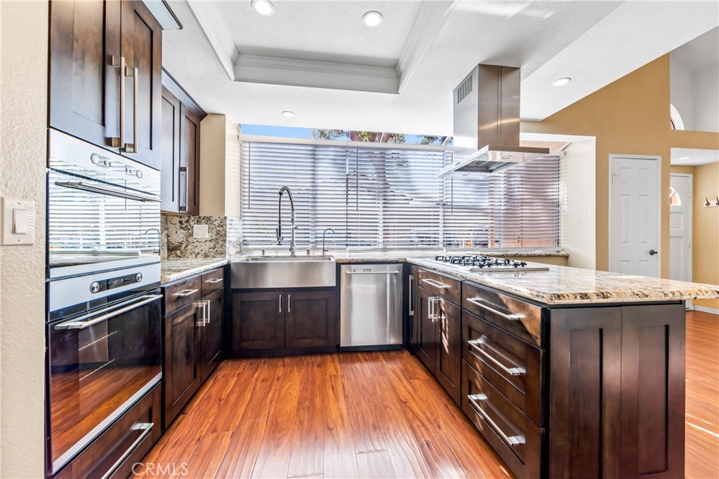 68 Marbella Aisle, Unit 34 Irvine, CA 92614 - Photo 6 of 38 Kitchen detail. Updated with excellent appliances, counters and wall-to-wall windows.