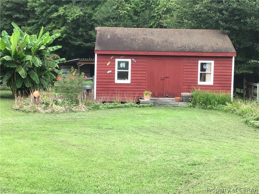 9924 Squirrel Run Road Gloucester, VA 23061 - Photo 17 of 37 View of outbuilding with a carport and a yard