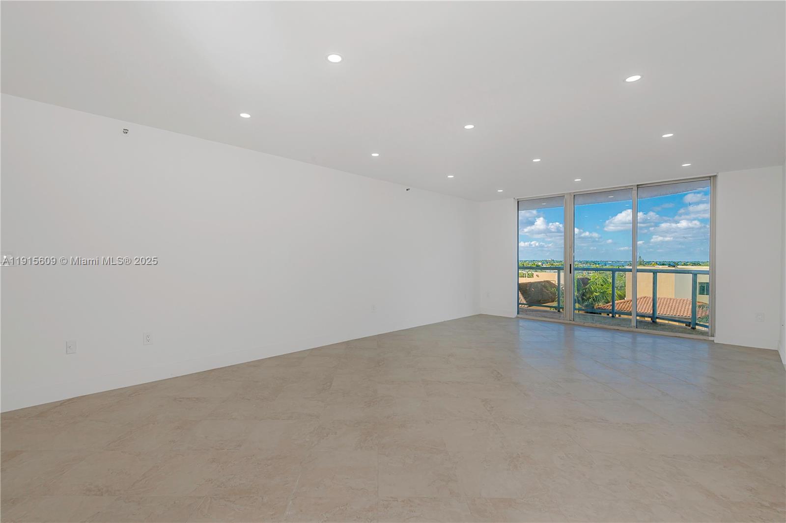 8855 Collins Avenue, Unit 6E Surfside, FL 33154 - Photo 4 of 24 a view of an empty room with a window
