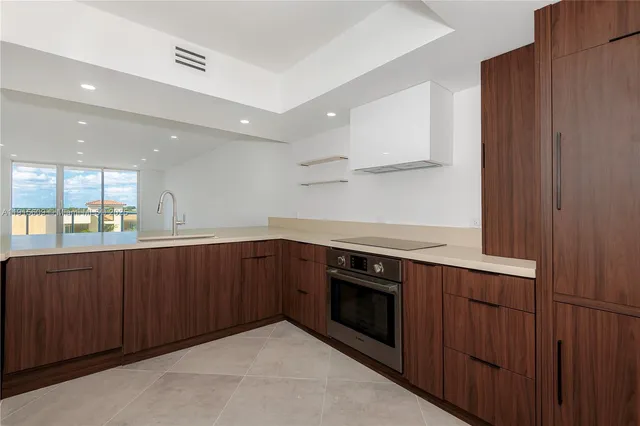 a kitchen with wooden cabinets and a sink