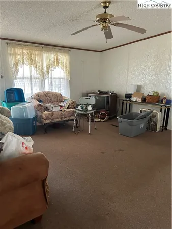 a kitchen with kitchen island granite countertop a stove a sink and a cabinets