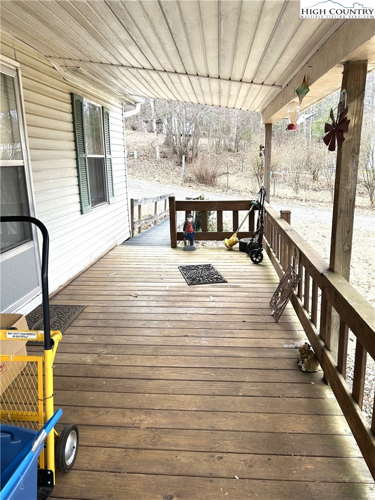 223 Poplar Lane Lansing, NC 28643 - Photo 3 of 12 a view of a balcony with chairs