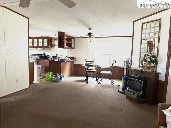 a view of a livingroom with furniture and a fireplace