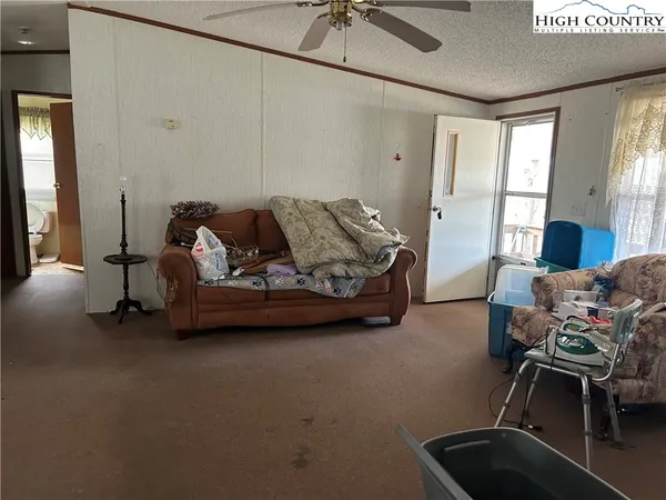 a bedroom with furniture and windows