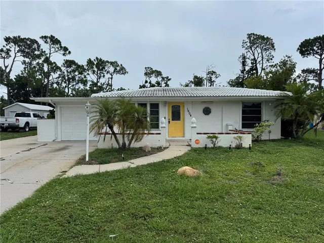 a front view of a house with a yard and porch