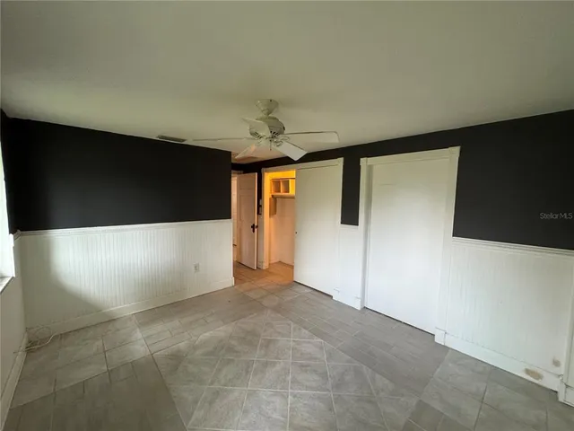 a bathroom with a toilet sink and shower