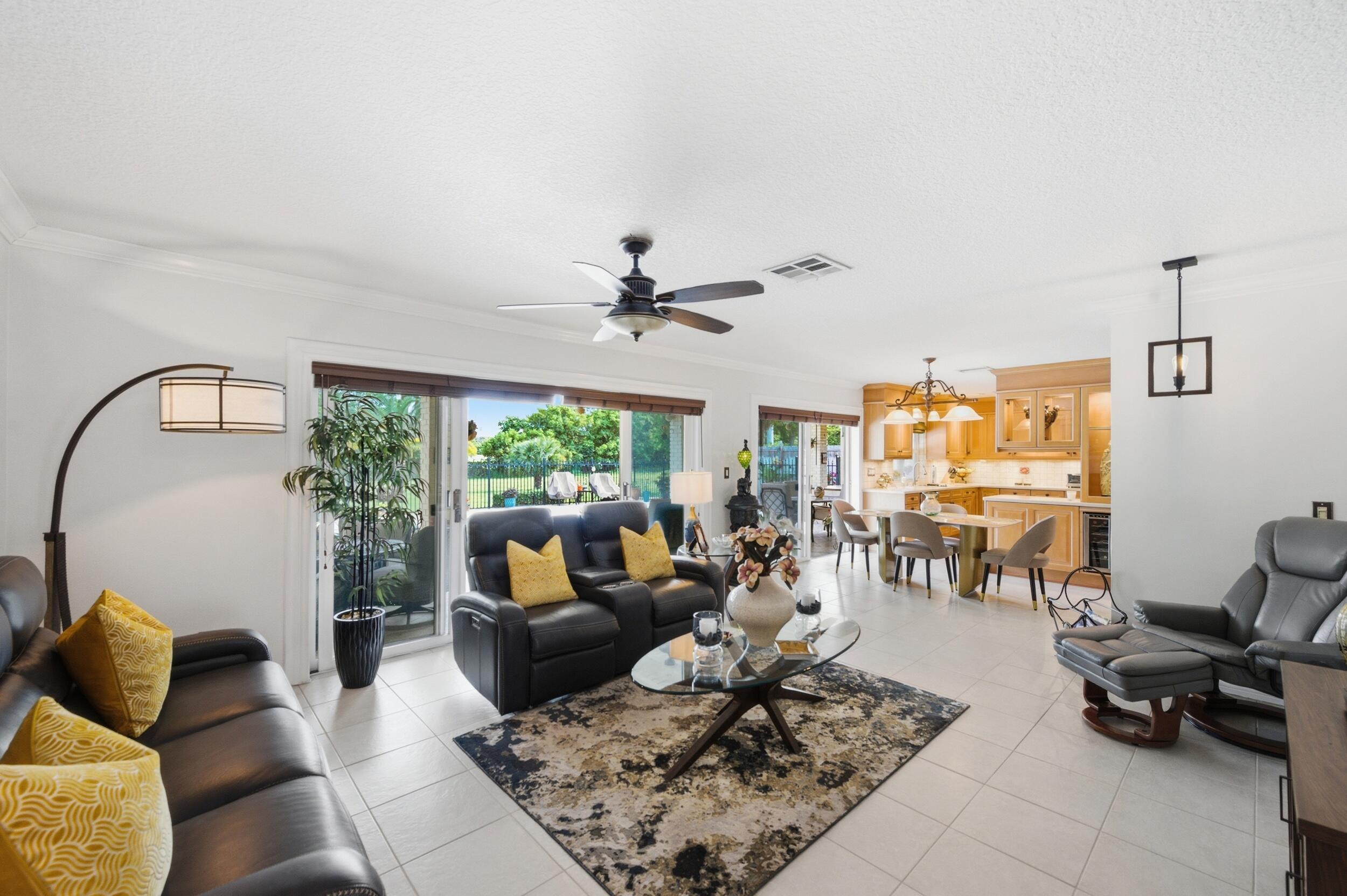 4780 Brandywine Drive Boca Raton, FL 33487 - Photo 7 of 43 a living room with furniture and a large window