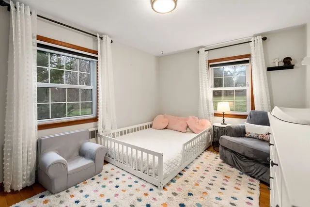 a bedroom with a bed and a couch