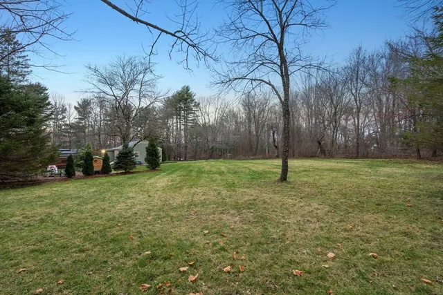 a backyard of a house with lots of green space