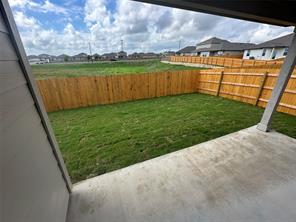 563 Evergreen Sumac Loop Kyle, TX 78640 - Photo 16 of 18 A spacious backyard with new wood fencing offers privacy and room for outdoor enjoyment.