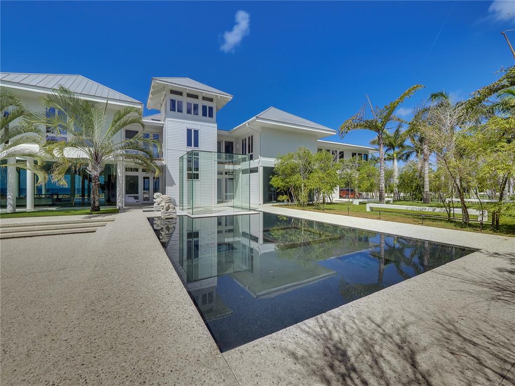 7712 Sanderling Road Sarasota, FL 34242 - Photo 1 of 1 Front of the home showing reflection pool and glass cube