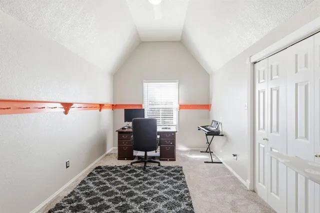 a view of room with rug and chair