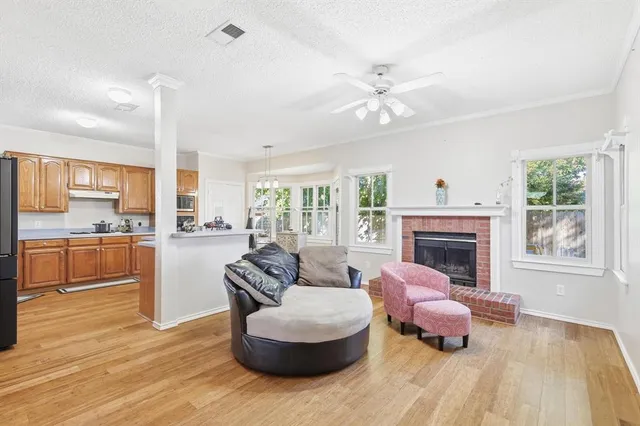 a living room with furniture and a fireplace
