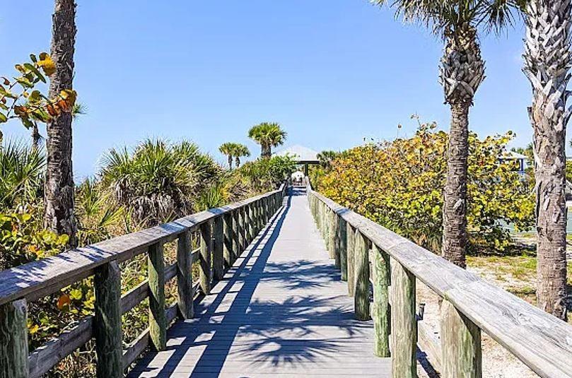 10249 Burlington Avenue Englewood, FL 34224 - Photo 12 of 12 a view of a balcony with wooden floor and fence