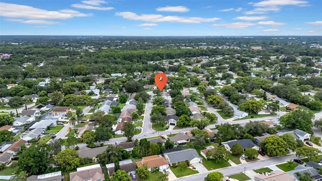 an aerial view of residential houses with city and lake view