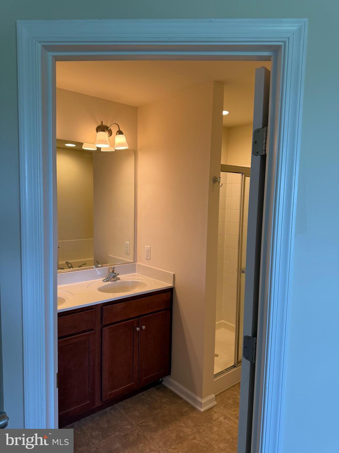 1130 Stallion Street Ranson, WV 25438 - Photo 18 of 24 a bathroom with a sink and mirror