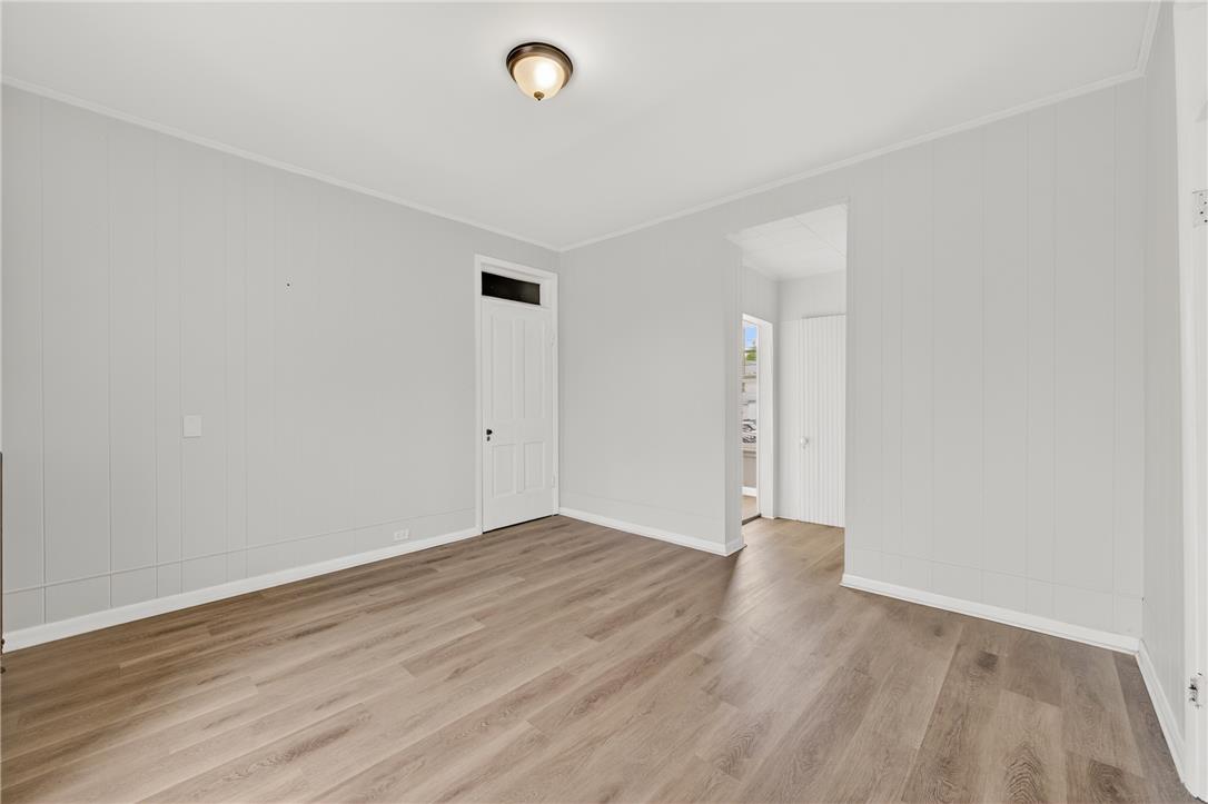 65 2nd Street Slatington, PA 18080 - Photo 37 of 46 This naturally illuminated room features durable flooring and a classic paneled wall, offering a clean, adaptable space.