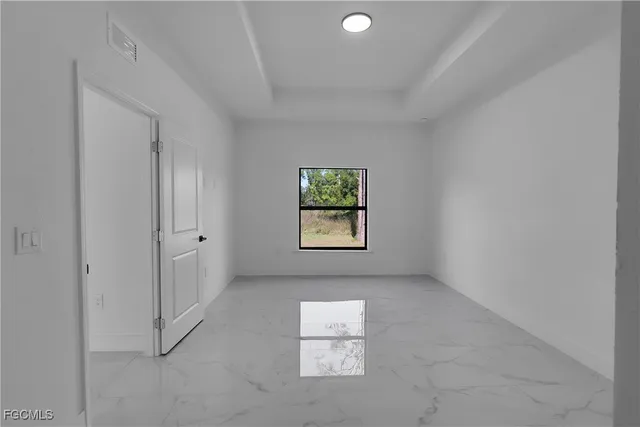 an empty room with windows