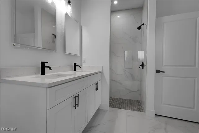 a bathroom with a sink and mirror