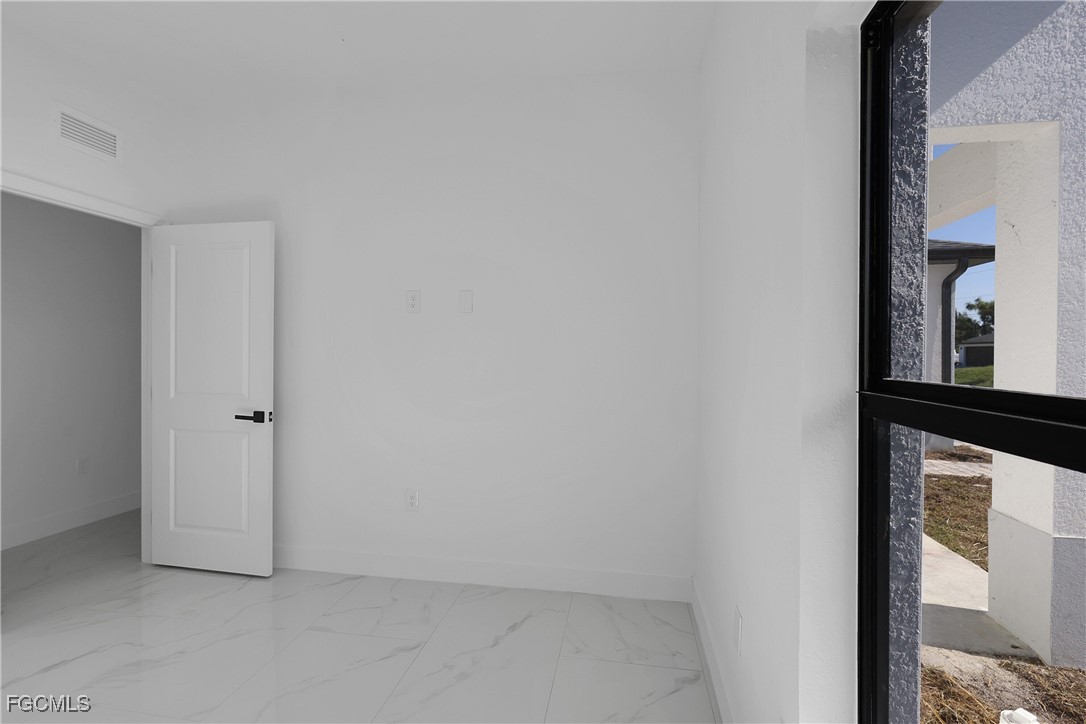 2810 44th Street Southwest Lehigh Acres, FL 33976 - Photo 27 of 31 a view of an empty room