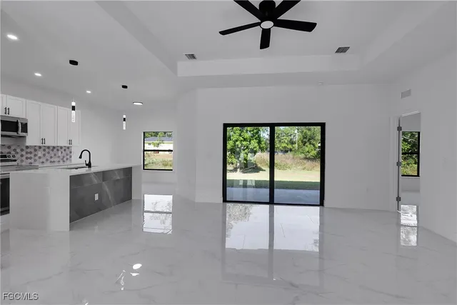 a view of a kitchen with a sink and a window