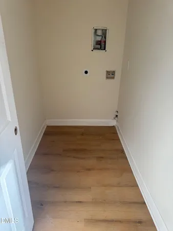 a view of a room with wooden floor