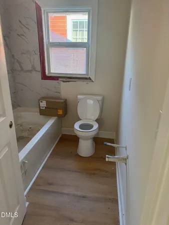 a bathroom with a toilet sink and bathtub