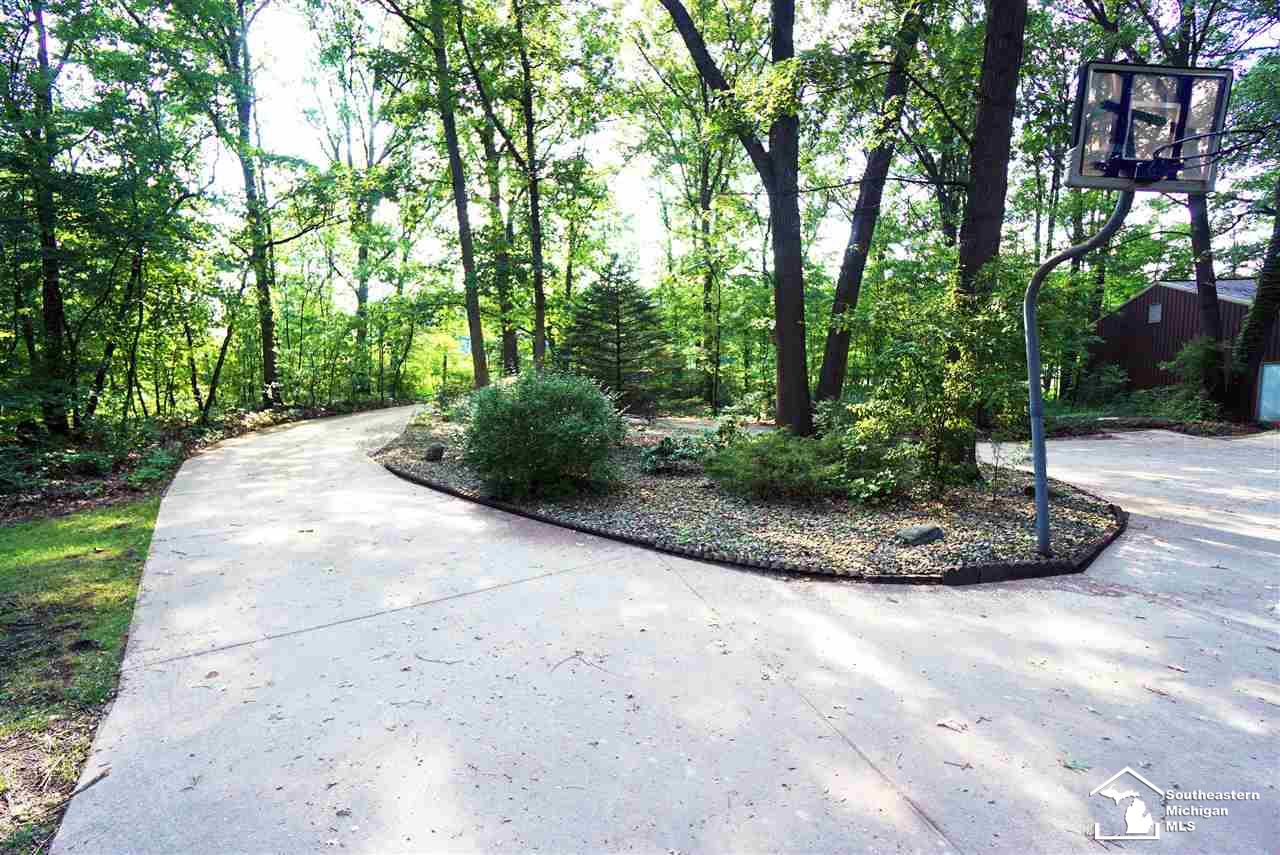 The drive way ends in a circular turnaround in front of the home for ample parking