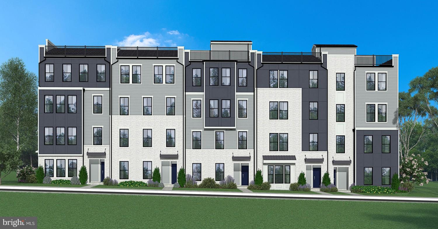 a front view of a building with a yard