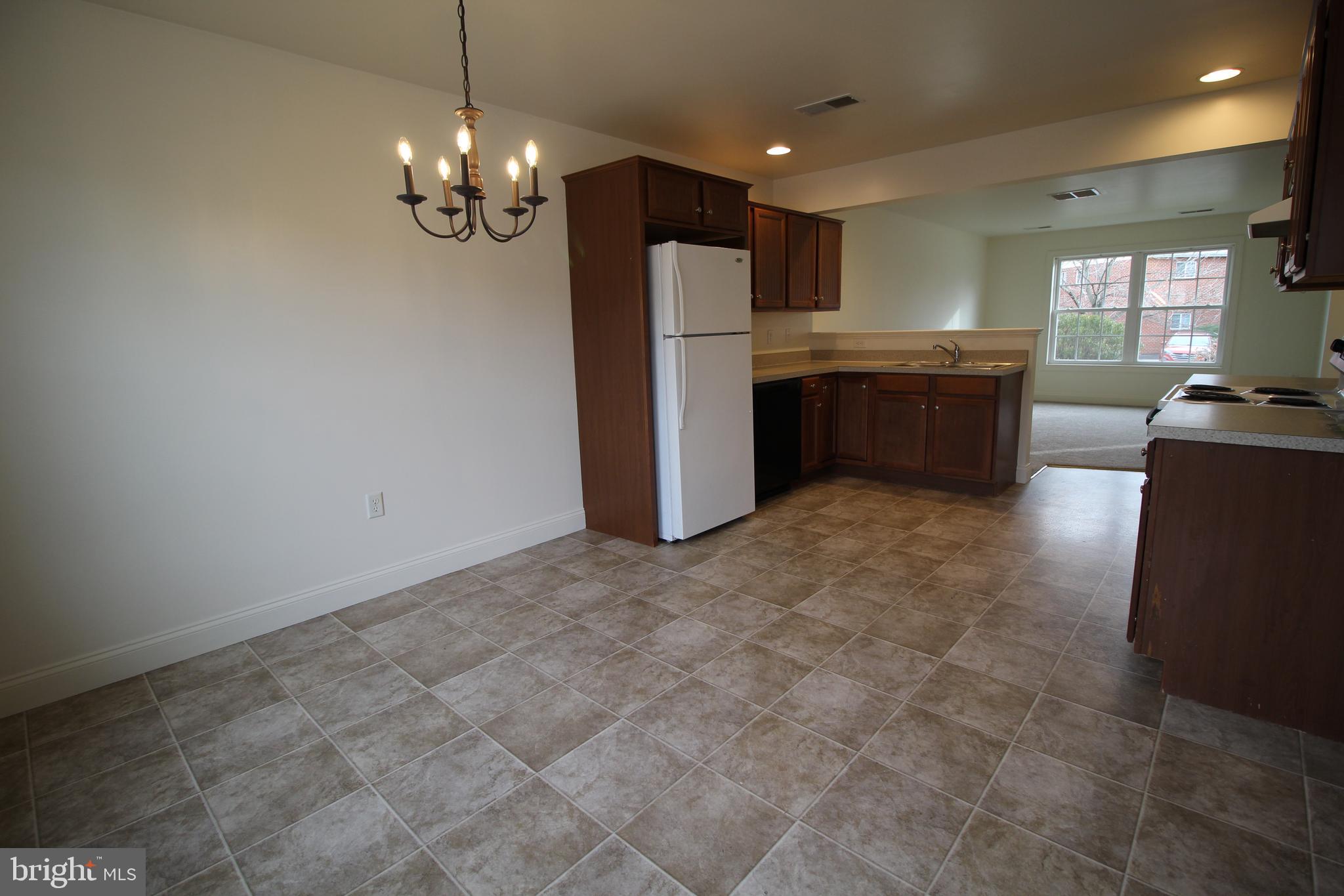 16 Bradford Drive Leola, PA 17540 - Photo 2 of 11 a kitchen with stainless steel appliances granite countertop a refrigerator and a stove top oven