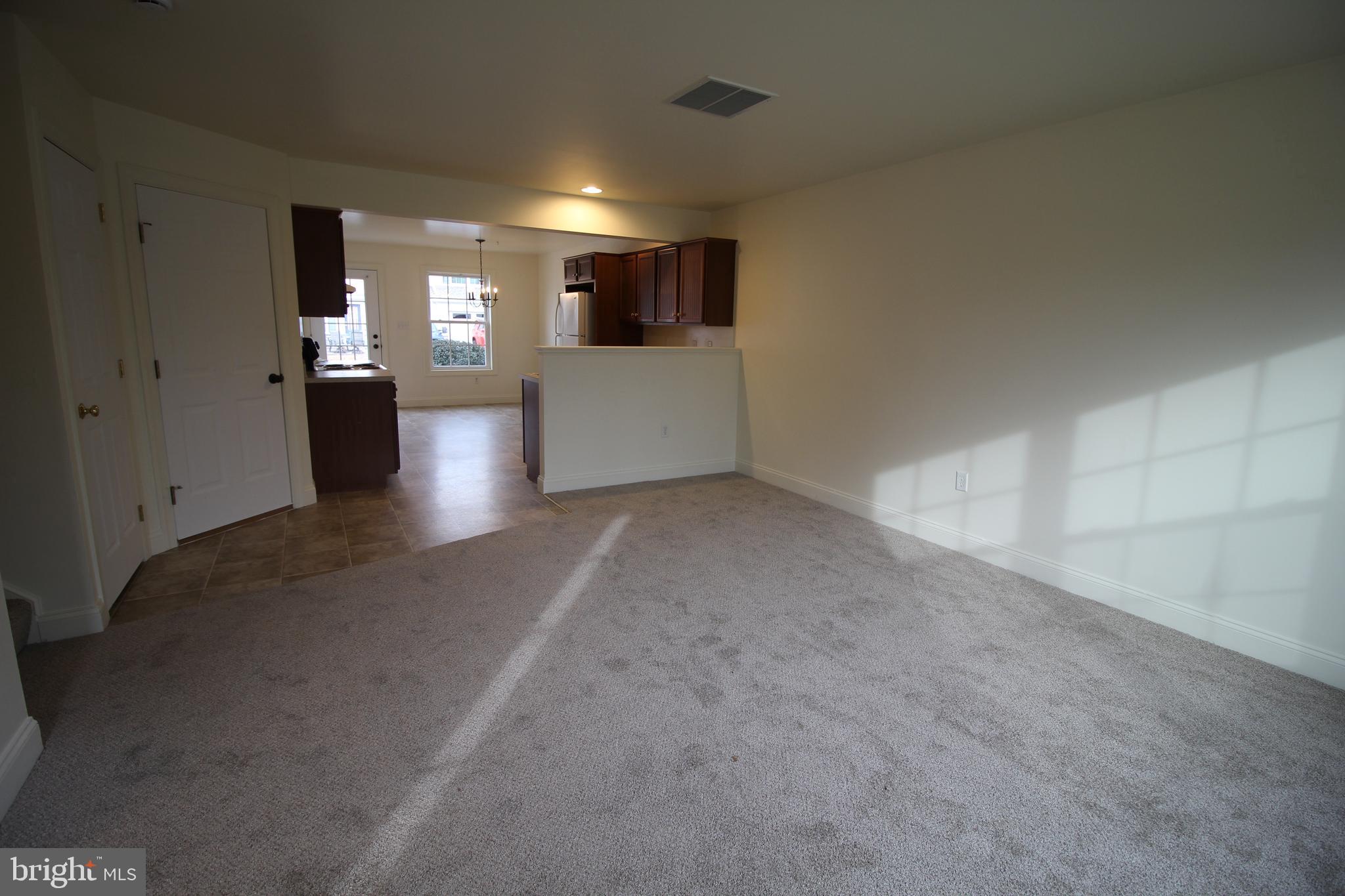 16 Bradford Drive Leola, PA 17540 - Photo 3 of 11 a view of a big room with windows and fireplace