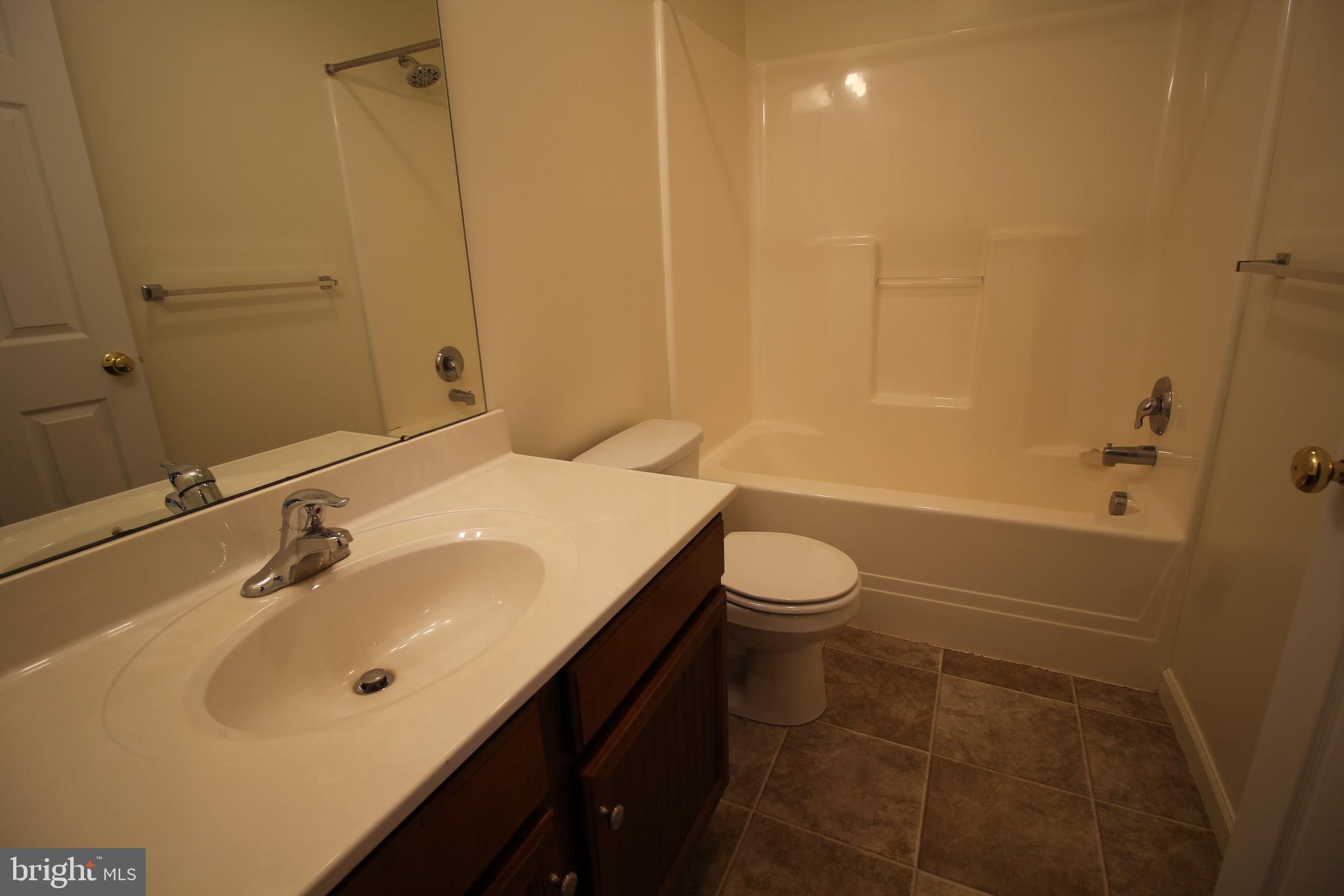 16 Bradford Drive Leola, PA 17540 - Photo 10 of 11 a bathroom with a sink a toilet and shower