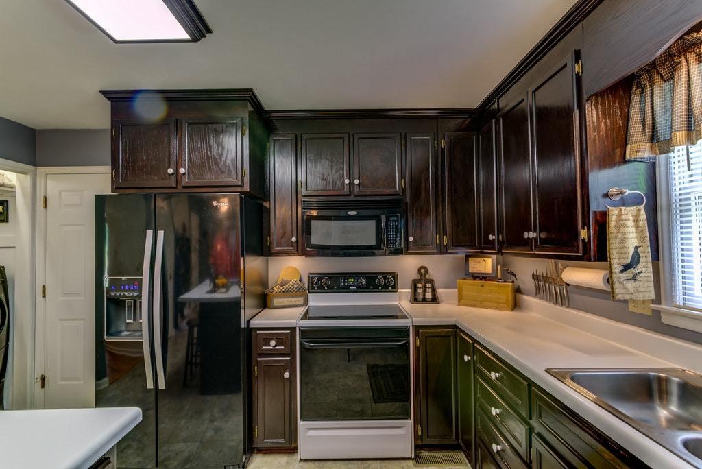 121 Oak Ridge Court Blue Ridge, VA 24064 - Photo 13 of 63 a kitchen with a sink stove and refrigerator