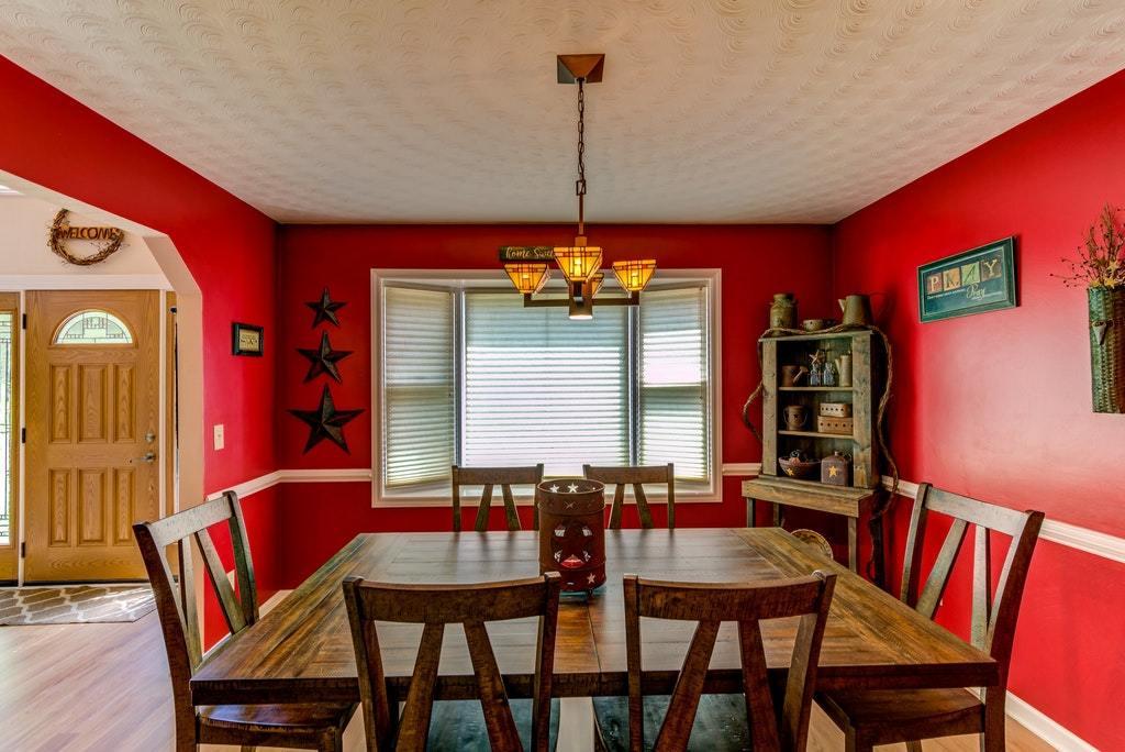 121 Oak Ridge Court Blue Ridge, VA 24064 - Photo 15 of 63 a view of a dining room with furniture and window