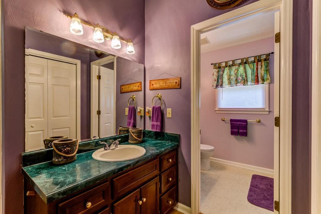 121 Oak Ridge Court Blue Ridge, VA 24064 - Photo 24 of 63 a bathroom with a granite countertop sink and a mirror