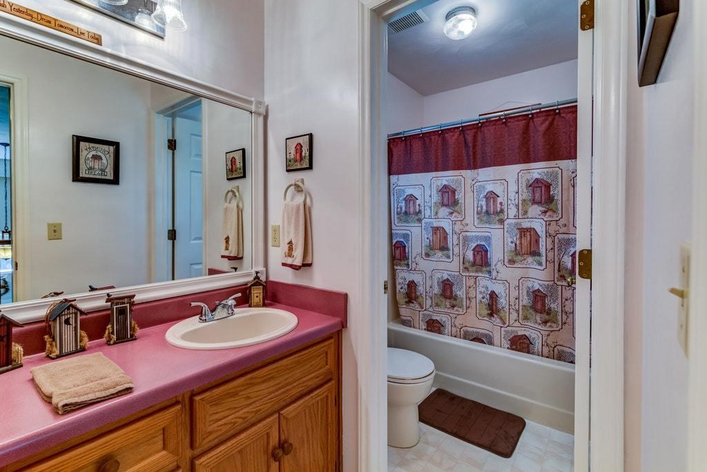 121 Oak Ridge Court Blue Ridge, VA 24064 - Photo 27 of 63 a bathroom with a sink and a mirror