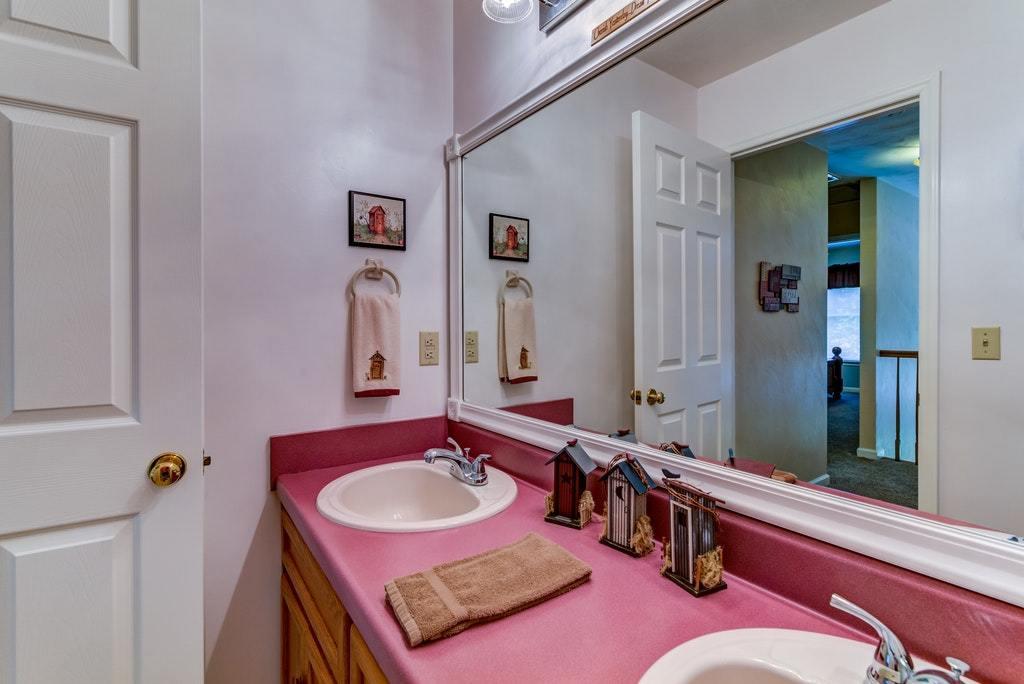 121 Oak Ridge Court Blue Ridge, VA 24064 - Photo 28 of 63 a bathroom with a sink double vanity and a mirror