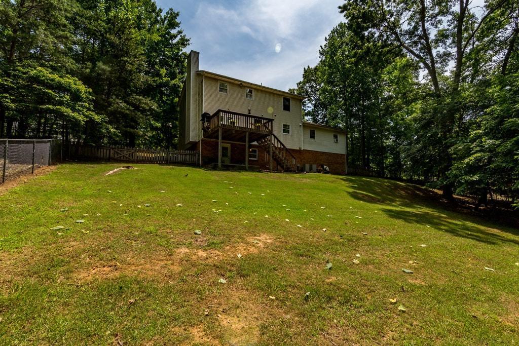 121 Oak Ridge Court Blue Ridge, VA 24064 - Photo 55 of 63 a view of a house with a yard and garage