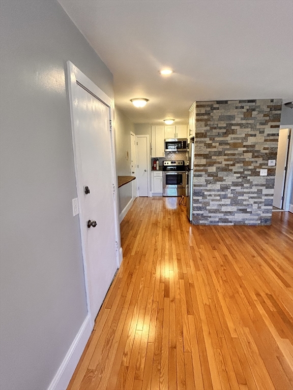 1409 River Street, Unit 47 Boston, MA 02136 - Photo 1 of 1 a view of kitchen and wooden floor