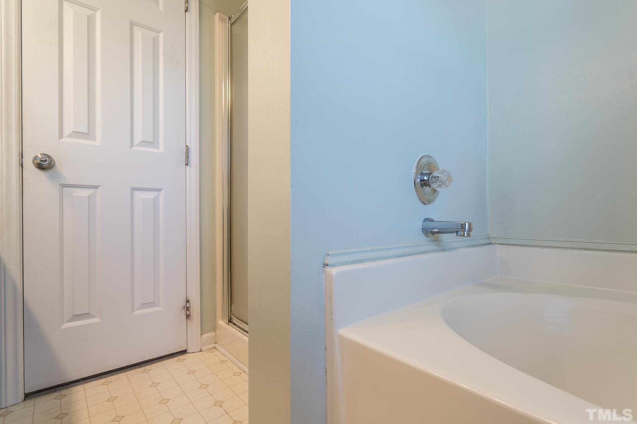 1004 Holland Ridge Drive Raleigh, NC 27603 - Photo 22 of 37 a bathroom with a bathtub