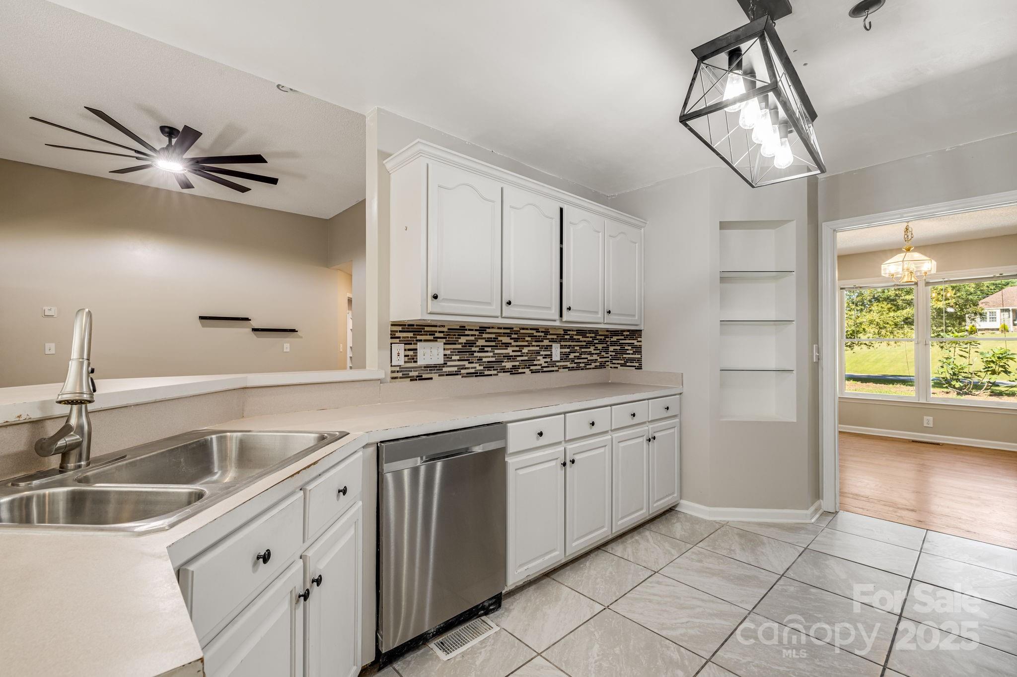 110 Ritchie Drive Shelby, NC 28152 - Photo 11 of 48 a kitchen with granite countertop a sink and cabinets