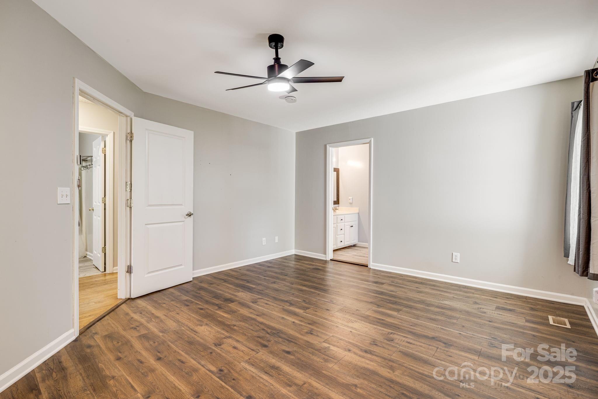 110 Ritchie Drive Shelby, NC 28152 - Photo 22 of 48 a view of livingroom with hardwood floor and ceiling fan