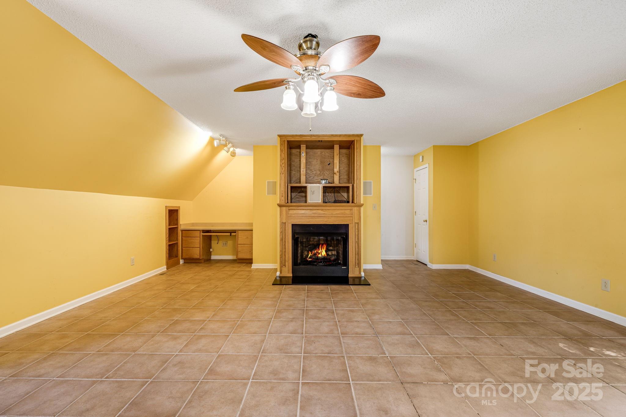 110 Ritchie Drive Shelby, NC 28152 - Photo 29 of 48 a view of an empty room with a fireplace and a window