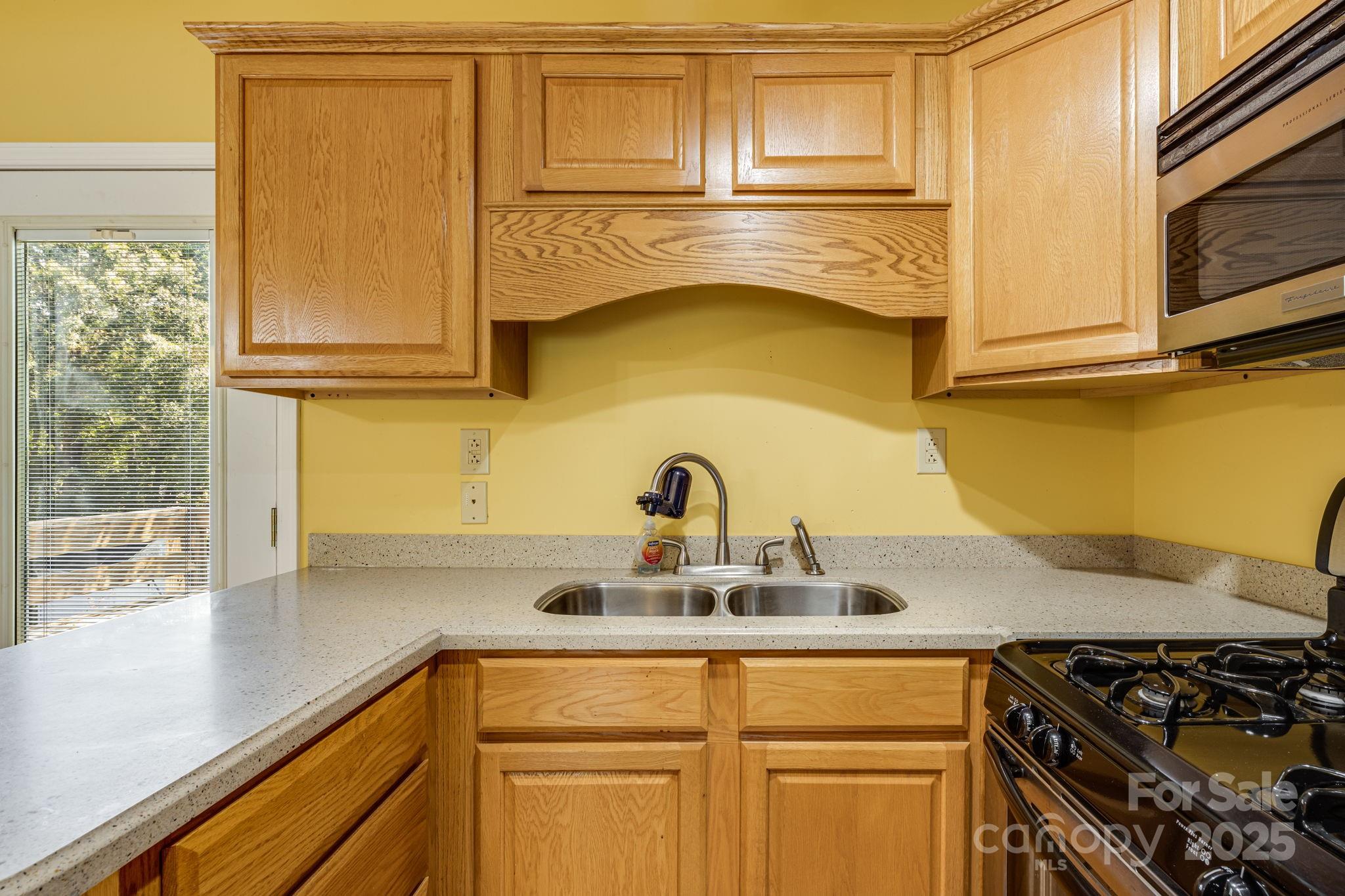 110 Ritchie Drive Shelby, NC 28152 - Photo 35 of 48 a kitchen with stainless steel appliances granite countertop a sink and a stove