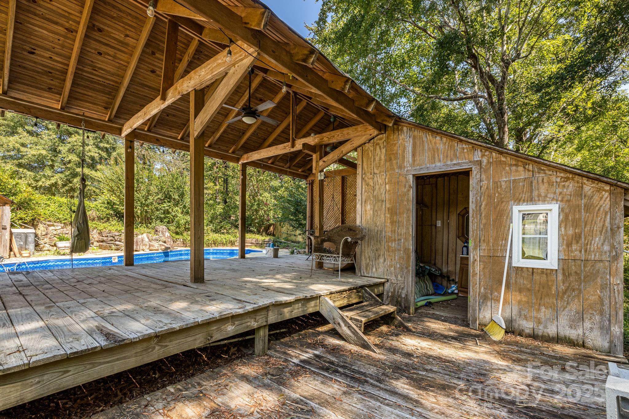 110 Ritchie Drive Shelby, NC 28152 - Photo 41 of 48 a view of backyard with wooden deck and a chair